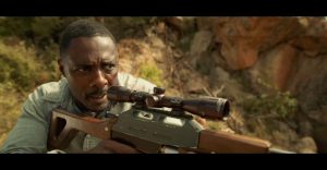 Idris Elba Holding a RIfle - The Movie Beast
